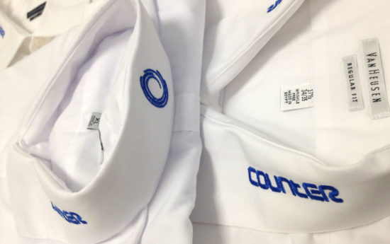Embroidery of white polos for Counter